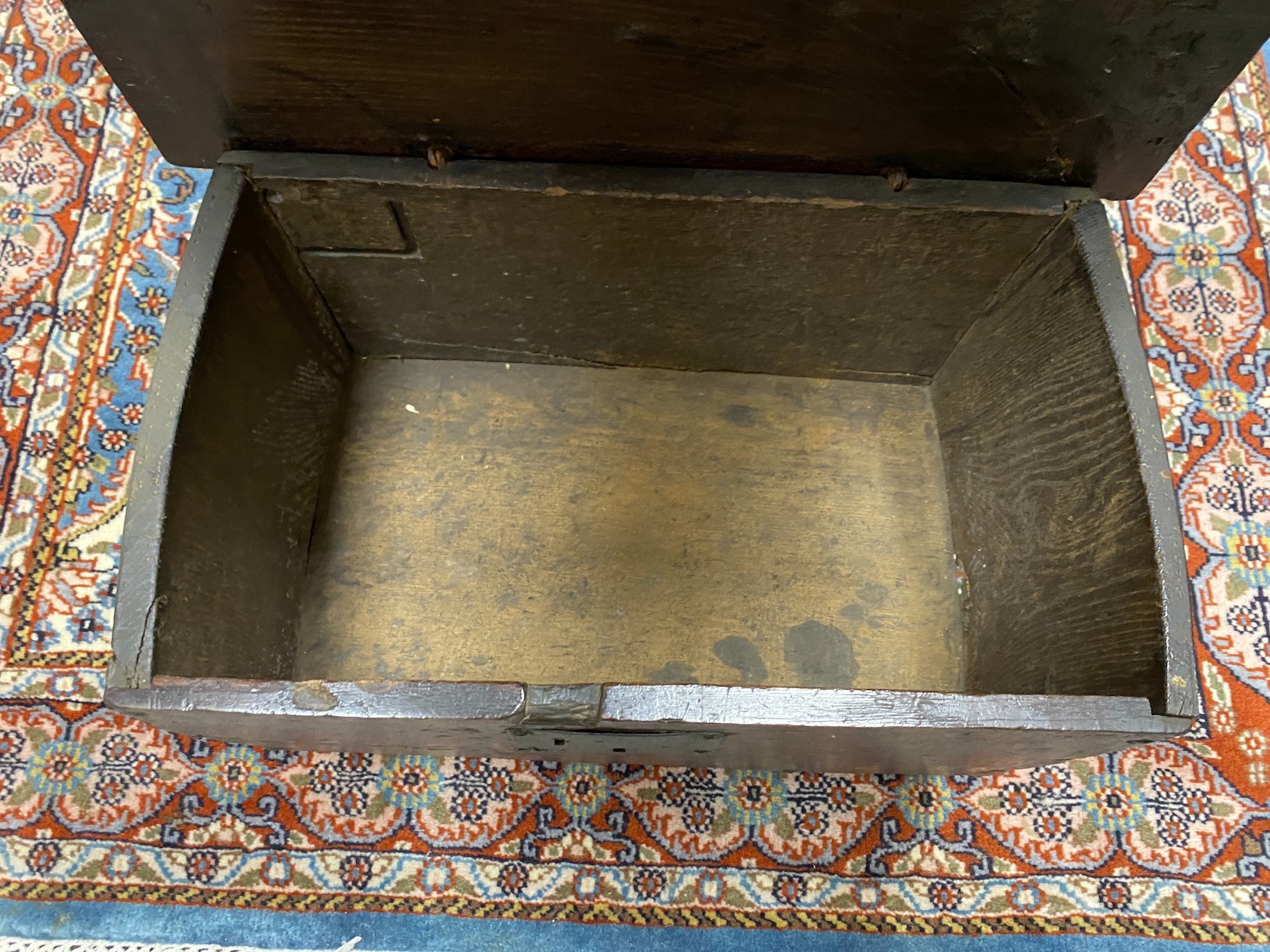An early 18th century oak six plank coffer, width 53cm, depth 33cm, height 33cm